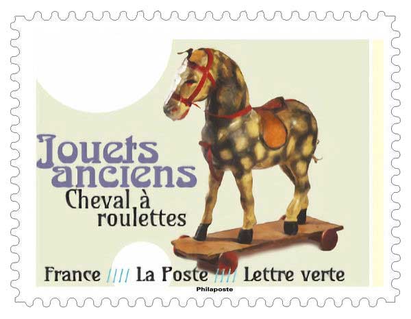 Timbre : JOUETS ANCIENS - cheval à roulettes